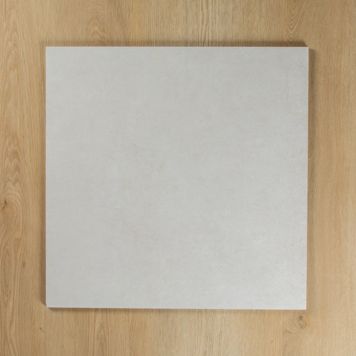 Boston Bianco Matte square tile on a wooden surface